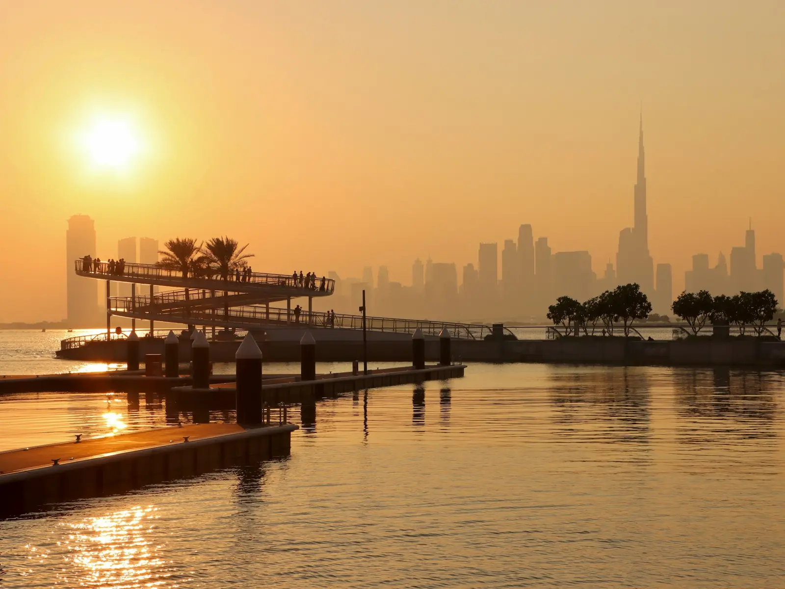 Dhows moored on Dubai Creek at sunset, a few minutes from our Al Ras head office